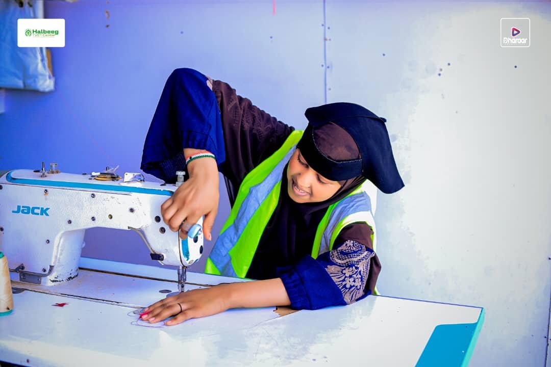 Student installing solar panels